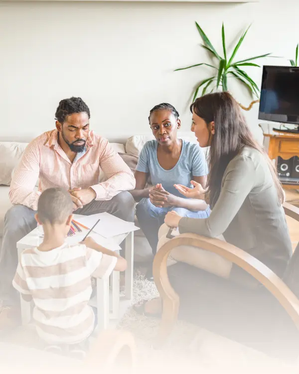 A family with parents and a child engaged in a structured family therapy session with a therapist in Ramsey NJ and Bergen County
